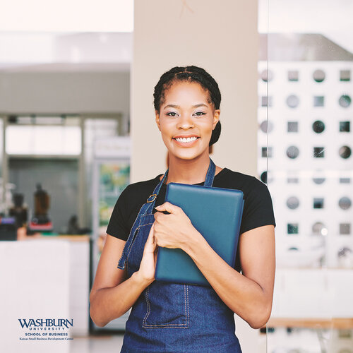 woman smiling holding tablet